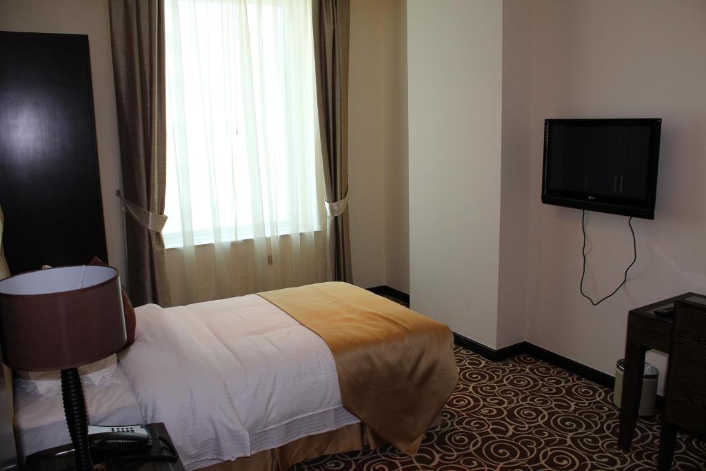 Mathema Premium Aparthotel Doha Bilik gambar